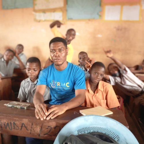 Charles with school children